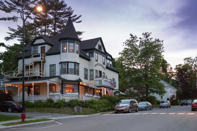 inn exterior with cars and streets