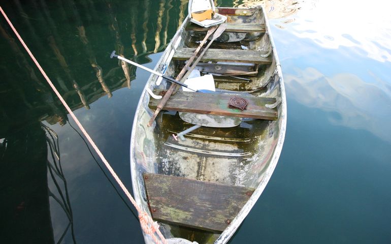 dinghy and reflection on water