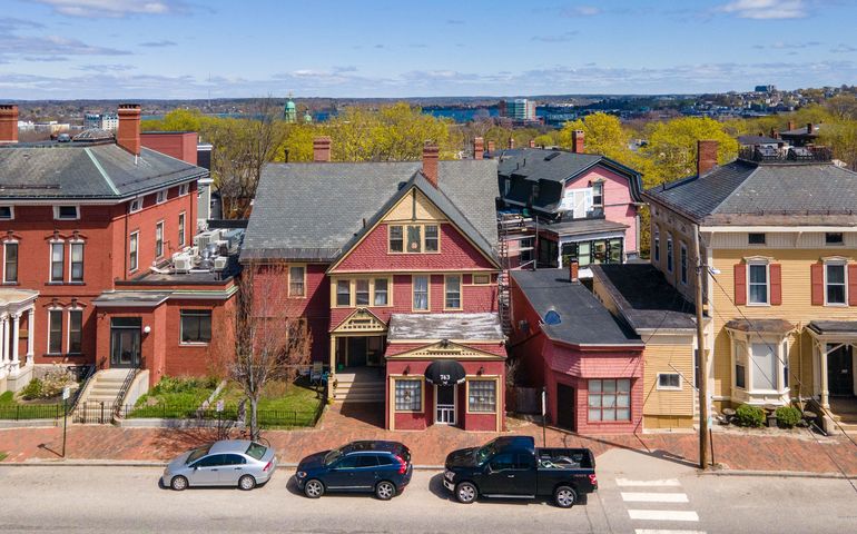 aerial of houses and vehicles