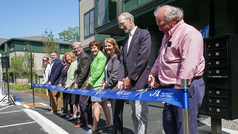 people cutting ribbon