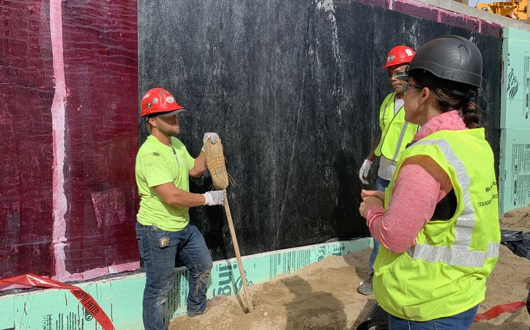 3 people with soil and foundation