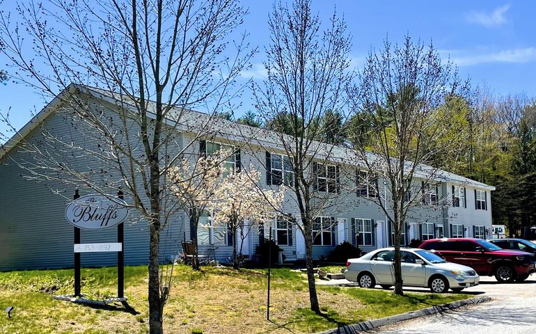 apartment complex and cars and trees
