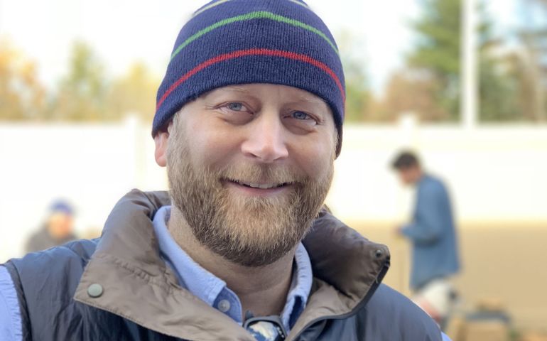 person in striped hat smiling