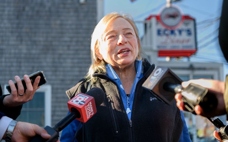 Janet Mills outside of Becky's Diner, talking to reporters.
