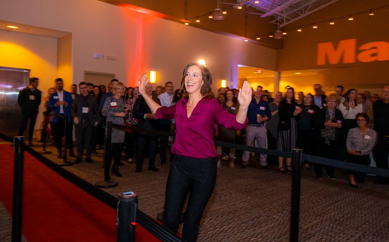 Michelle Anderson going up to the stage 