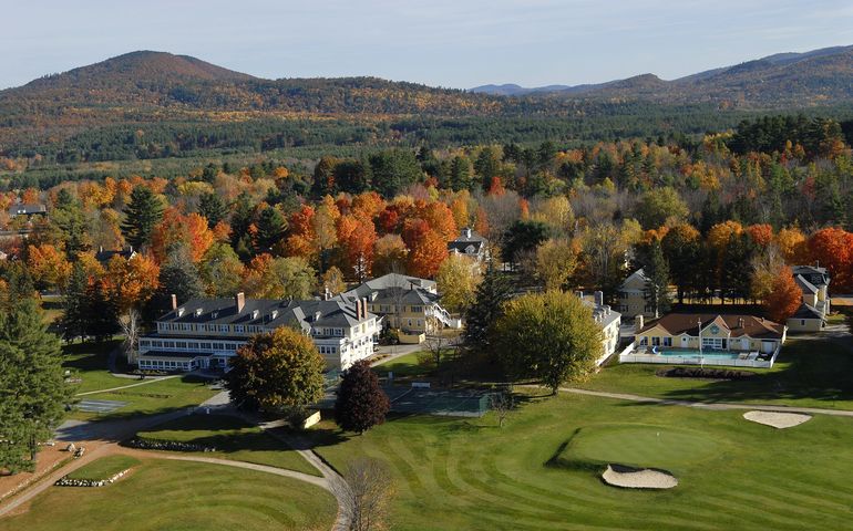 resort with golf course and mountains