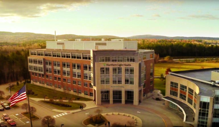 orange tinted aerial of building facade and flag