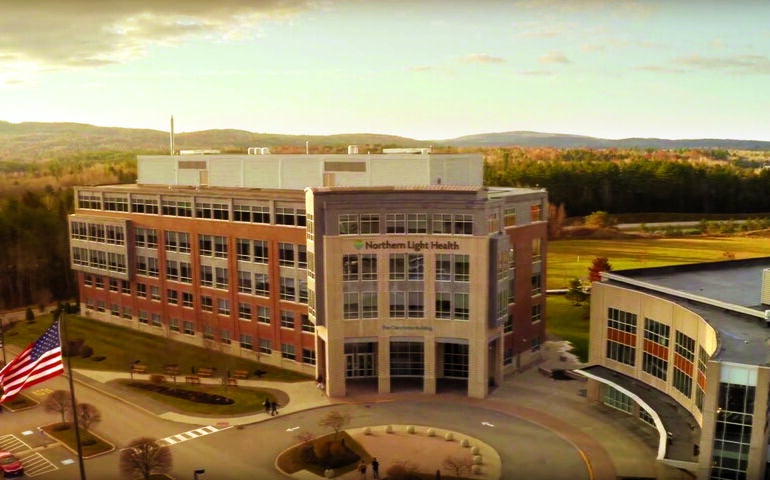 orange tinted aerial of building facade and flag