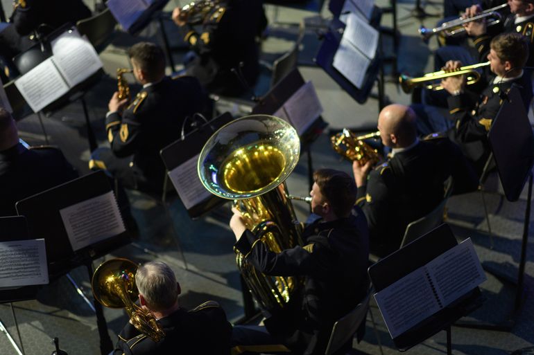 View from above of military musicians with instruments and stands with sheet music