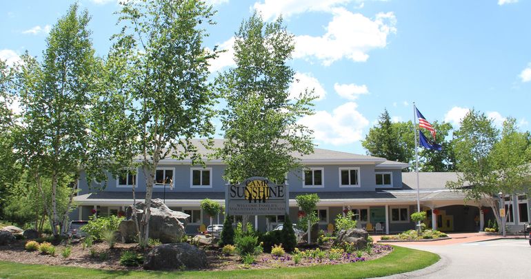 building with flag and sign