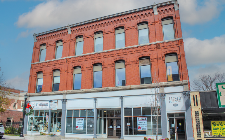 brick building with storefront windows