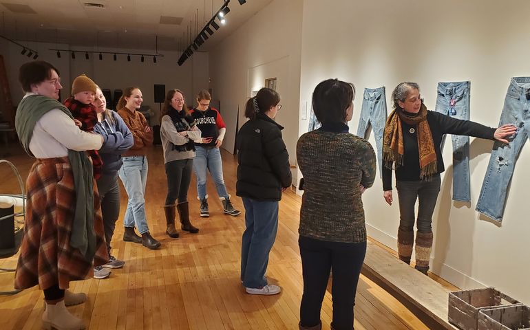 people with jeans on wall