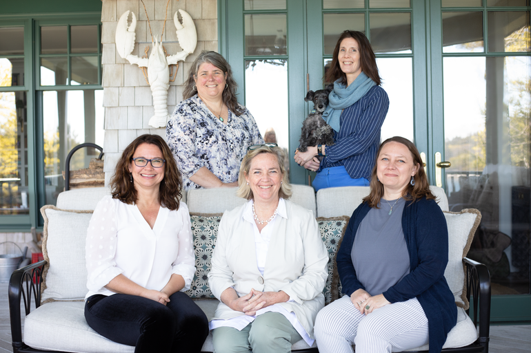 5 people smiling on porch