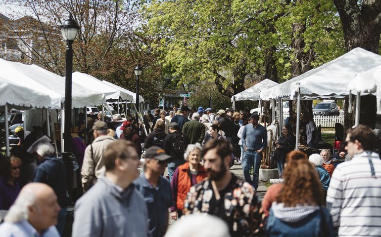 crowd of people and booths