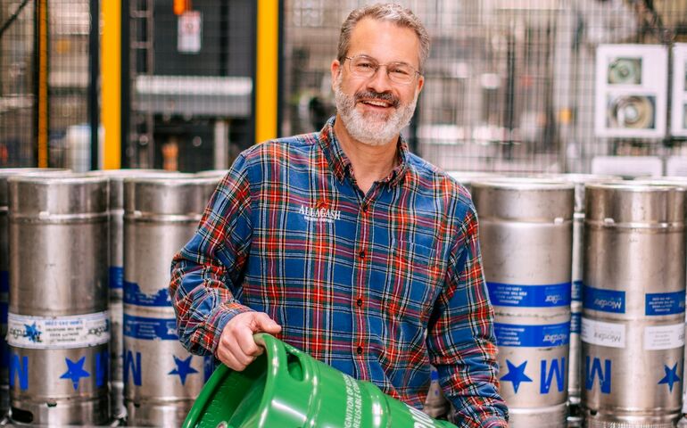 Rob Tod holding green keg