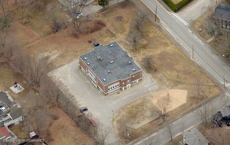 aerial of brick building and brown ground