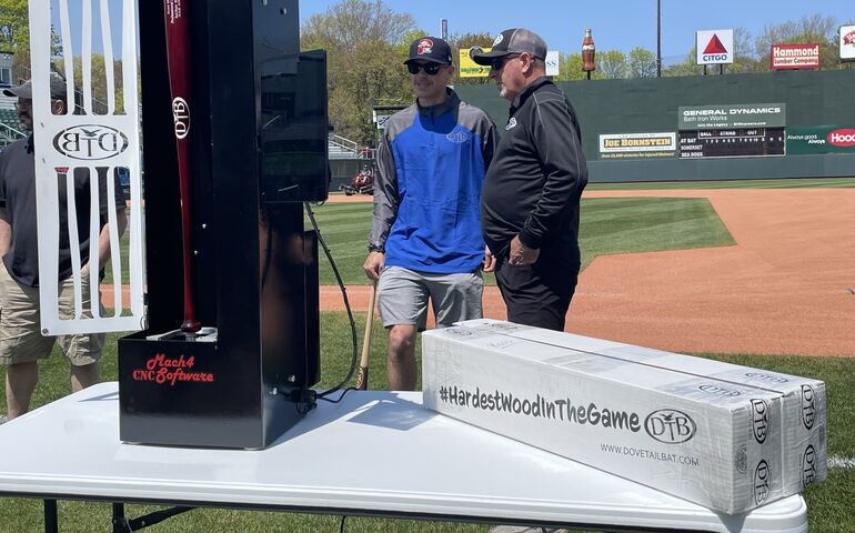 two people with bat scanner at Hadlock Field