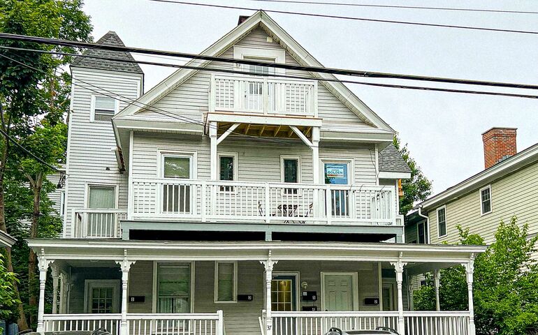 gray building with porch