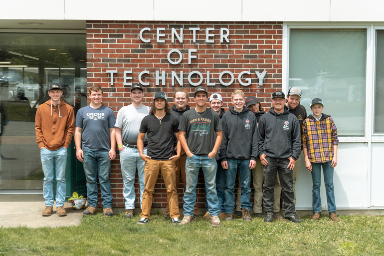 Students with the Maine Construction Academy are lined up after graduation. 