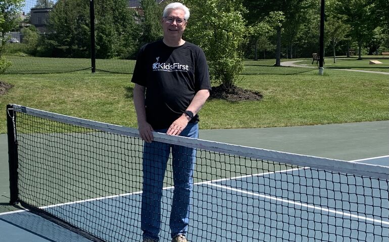 Guy on a pickleball court 