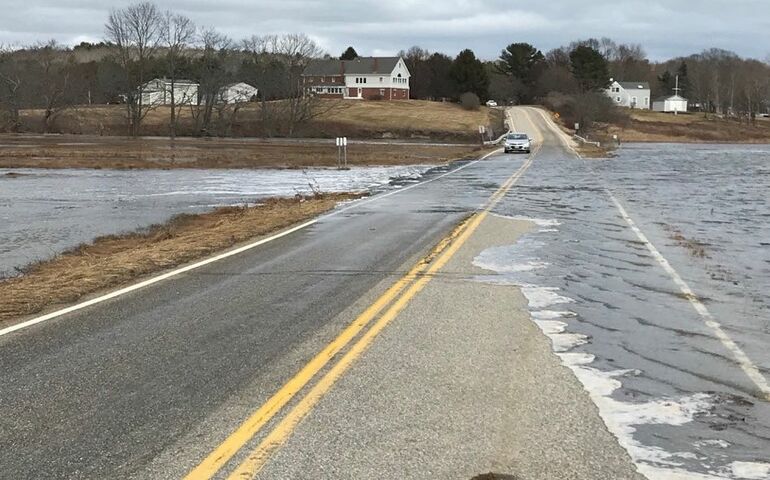 flooded road with car