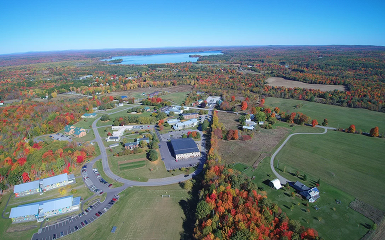 aerial of campus with buildings and lawns