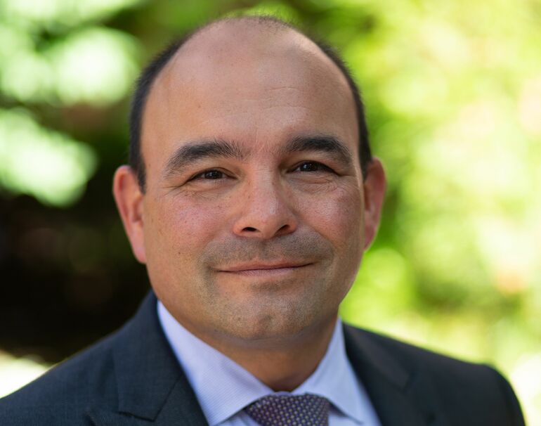 person in suit and tie smiling