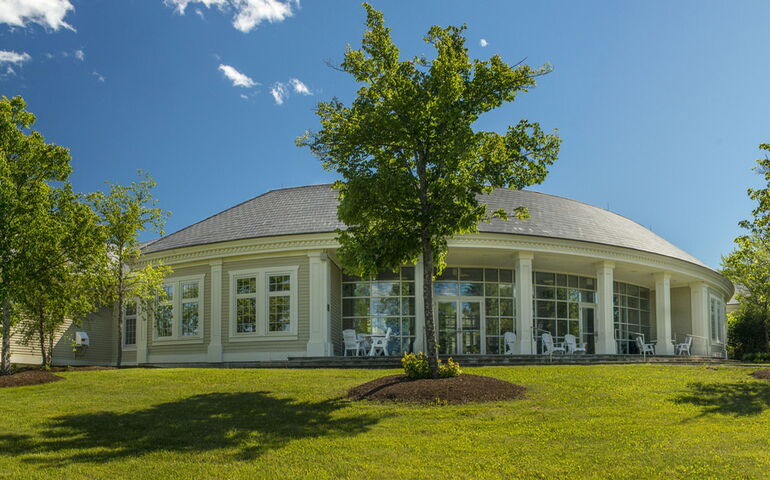 round building with trees and lawn