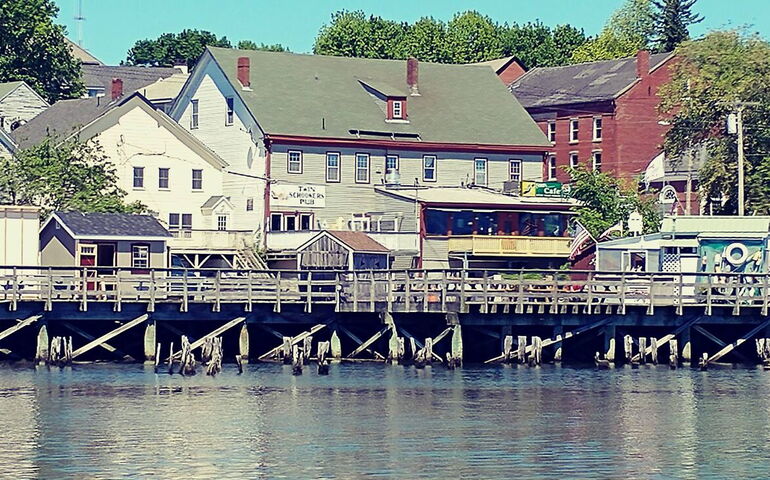 building with deck and water