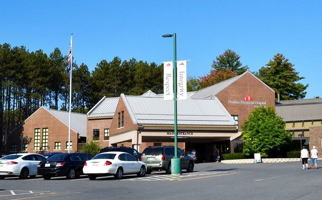 A brick hospital building's exterior.