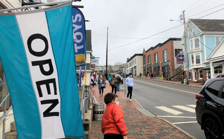 people on street and flags