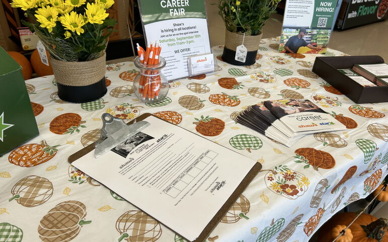 Inside of store with table for job applicants