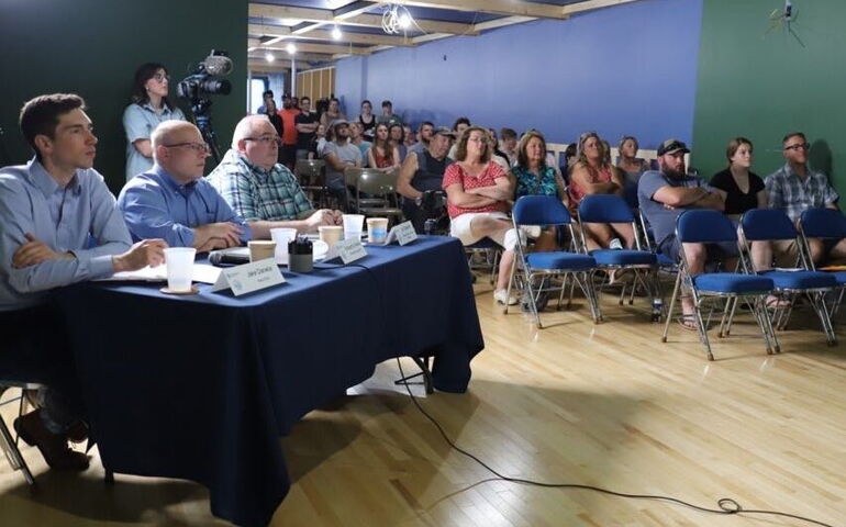 people sitting at table and in chairs