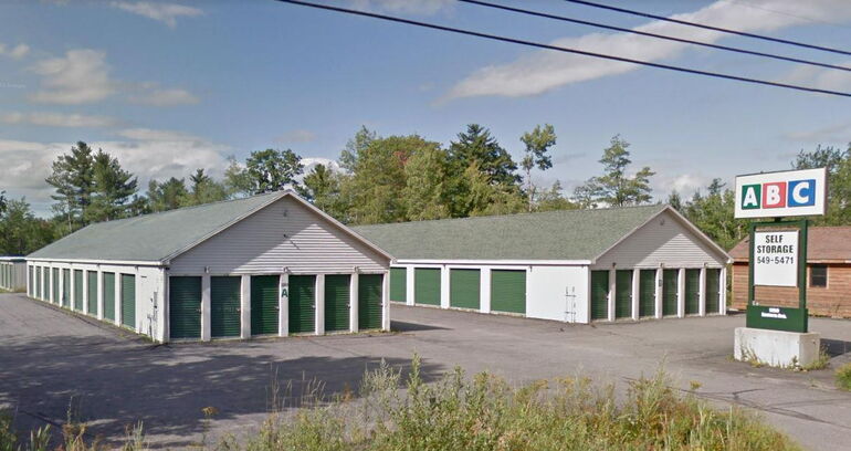 2 storage buildings and sign