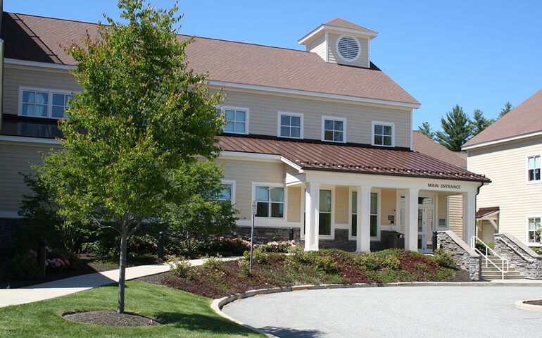 building with pillars and driveway