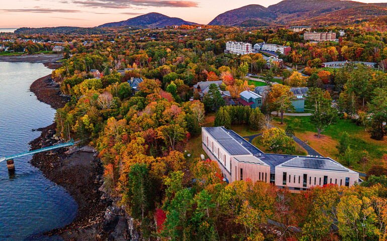 aerial of buildings and coloful trees