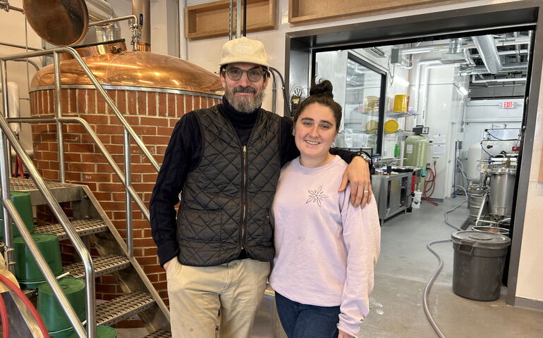 Two people in a brewery 