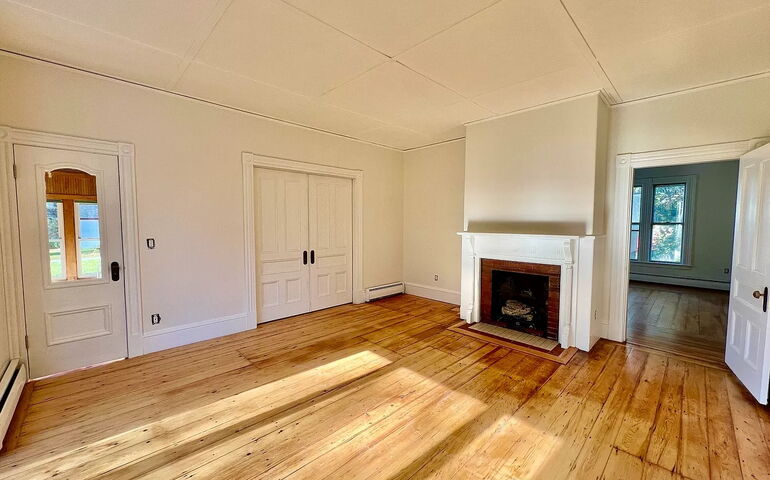 interior of room with doors and fireplace