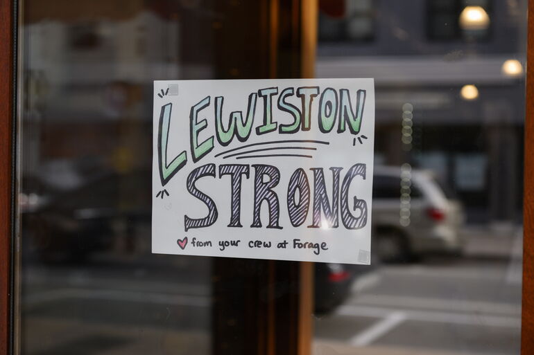 Shop window with 'Lewiston Strong' 