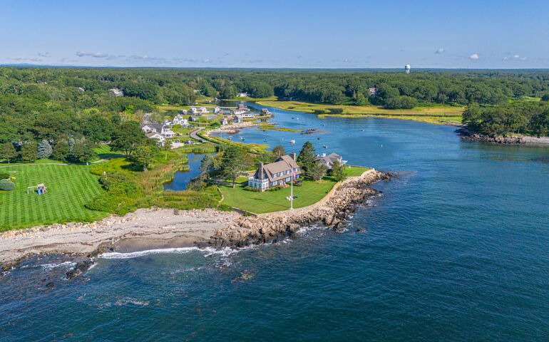 aerial of structures, lawns and water