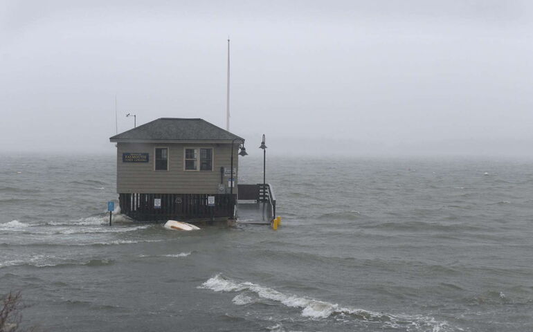 building in the water with gray sky