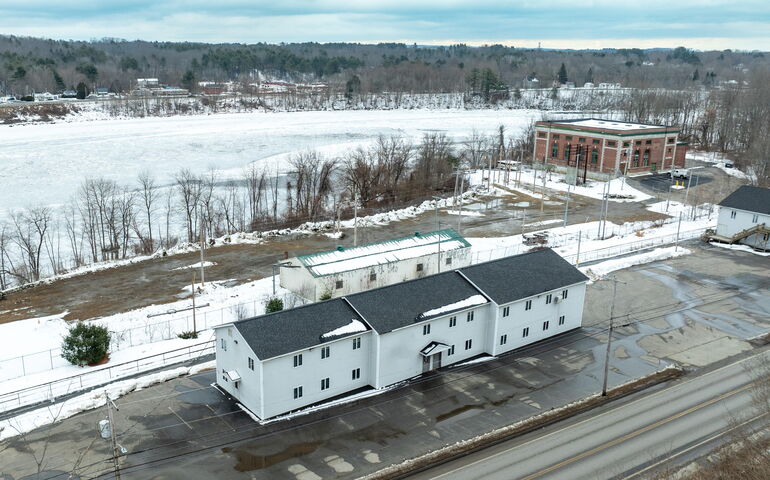 long white building and snowy ground