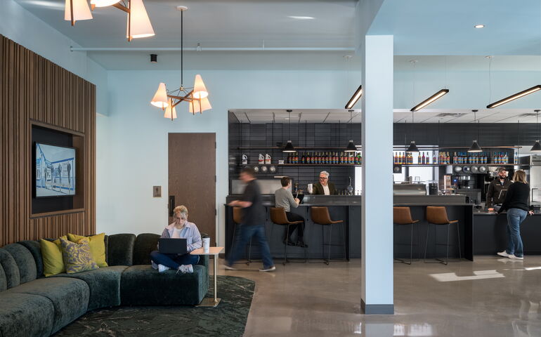 space with counter, stools, couches and pillar