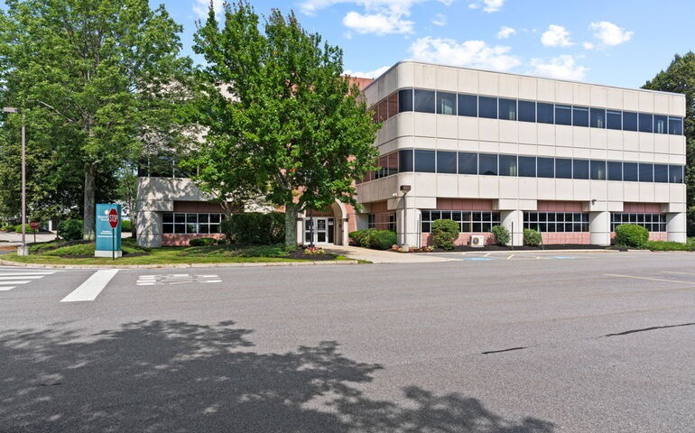 white building and parking lot