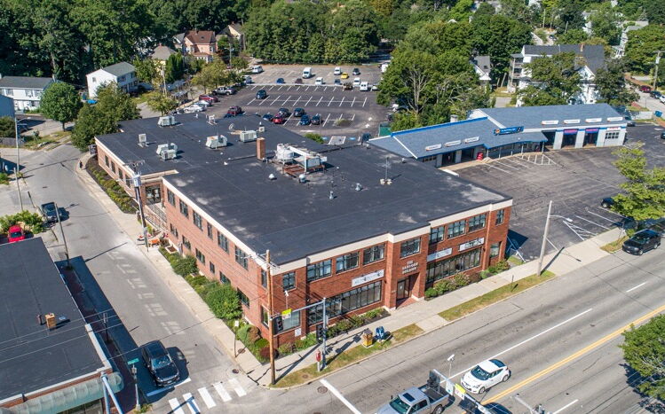 aerial view of brick building and streets