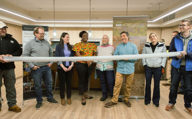 line of people with ribbon