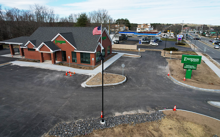 aerial view of buliding and parking lot and street