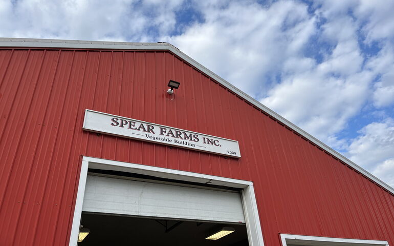 building with red siding and roll-up doors