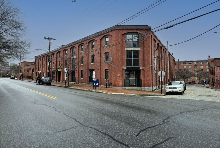 old brick building and cracked pavement