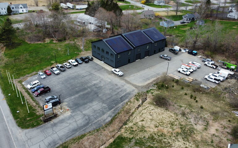 This aerial view shows SolarLogix's new facility and parking lot.